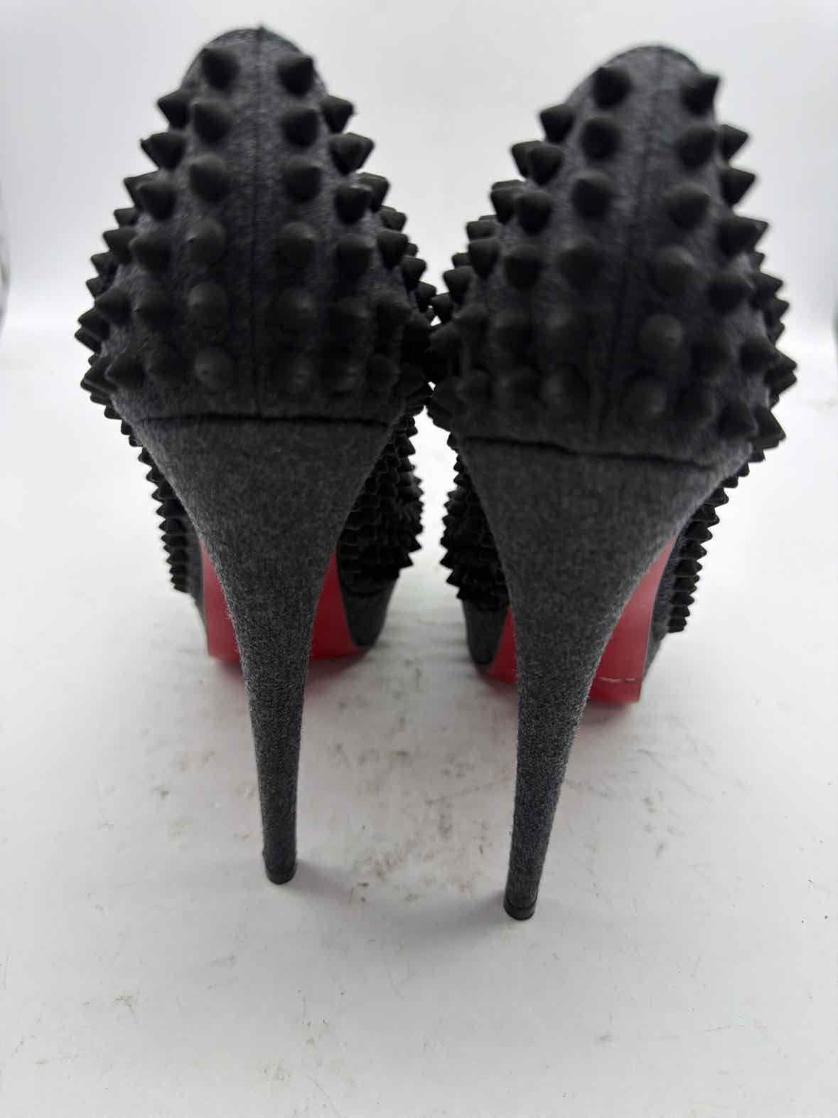 Pre-Owned Christian Louboutin Grey Size 8.5 spike accent Peep Toe Heels | True Fashionistas.
