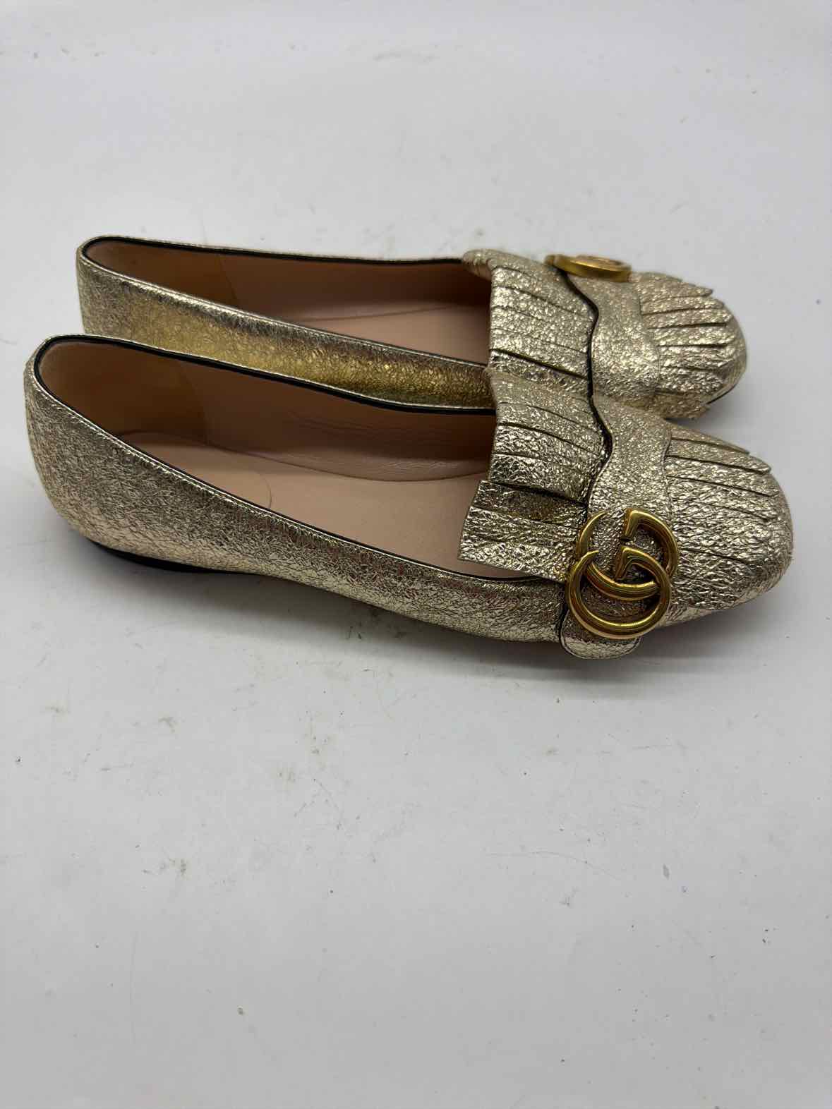 Pre-Owned Gucci Gold Size 6 GG Marmot Fringe Flat Flats | True Fashionistas.