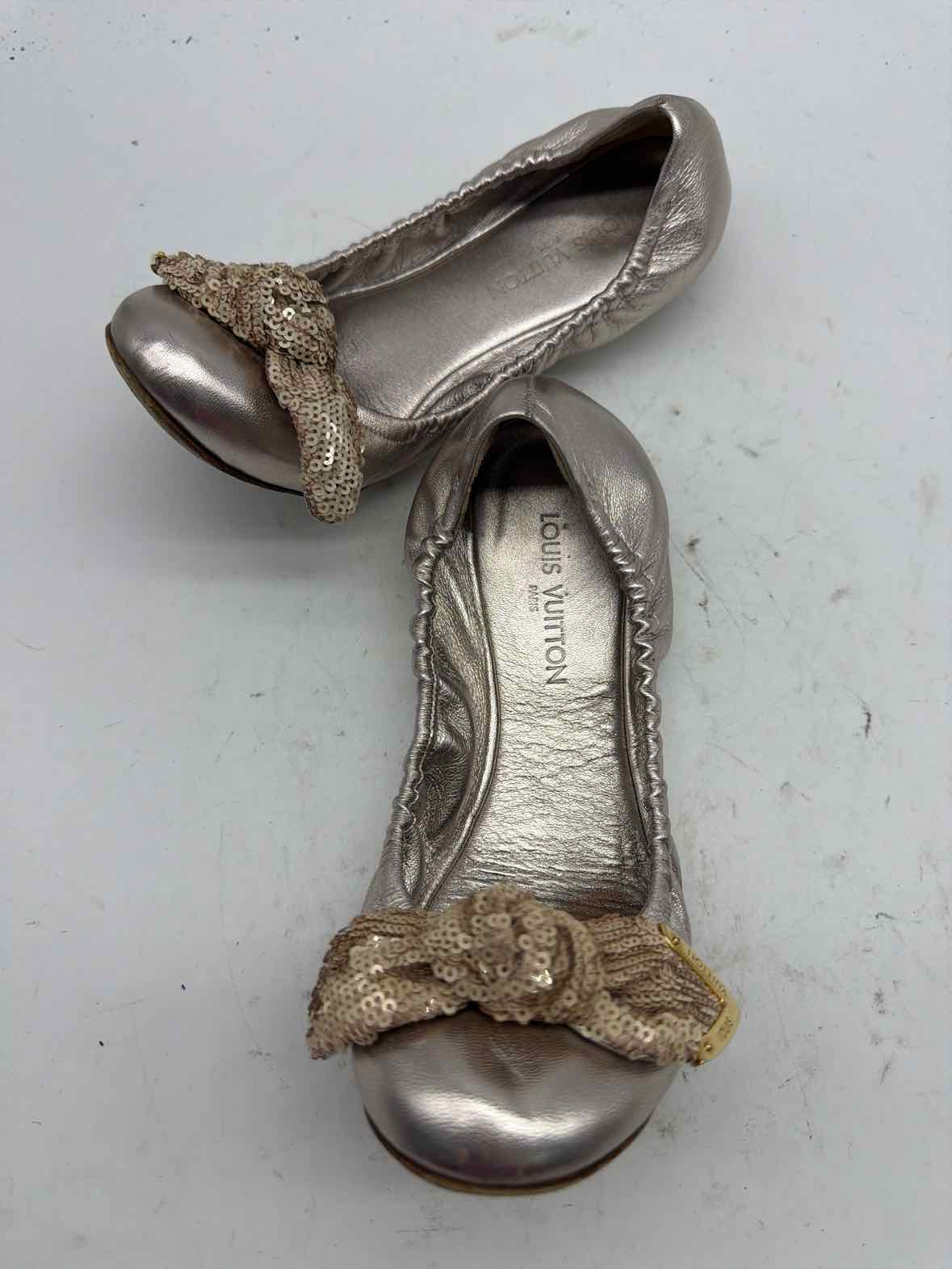 Pre-Owned Louis Vuitton Gold Size 6 Slip On Flats | True Fashionistas.