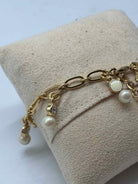 Pre-Owned Kate Spade Gold and White Beads Clasp Bracelet | True Fashionistas.