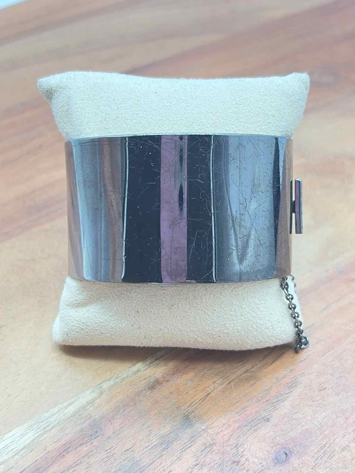 Coach Gunmetal Turnlock Bangle Bracelet | True Fashionistas.