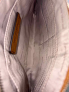 Pre-Owned Michael Kors Tan Clutch Clutch | True Fashionistas.