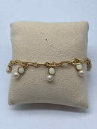 Pre-Owned Kate Spade Gold and White Beads Clasp Bracelet | True Fashionistas.