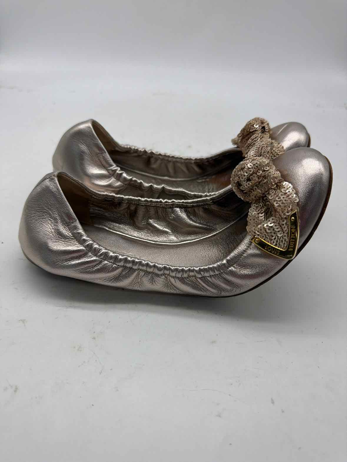 Pre-Owned Louis Vuitton Gold Size 6 Slip On Flats | True Fashionistas.