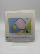 Blue Poppy Pickle Ball Needlepoint | True Fashionistas.