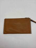 Pre-Owned Michael Kors Tan Clutch Clutch | True Fashionistas.